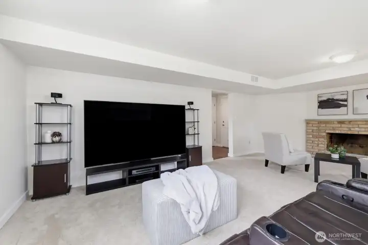 Spacious bonus room with second wood-burning fireplace
