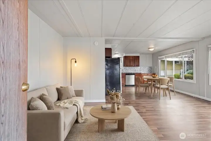 virtually staged living area from secondary entrance