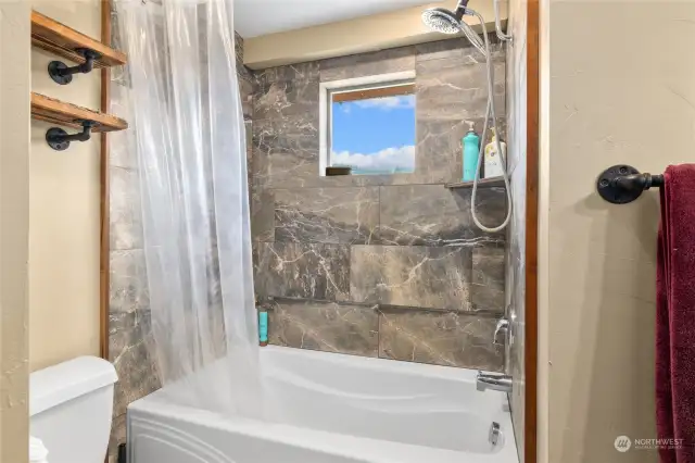 Deep soak tub/shower combo.