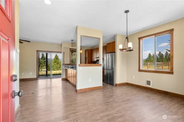 Open concept with dining, living and kitchen all within the same area.