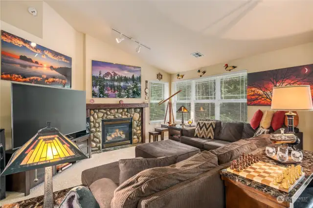 Spacious living area with view to breakfast bar and kitchen