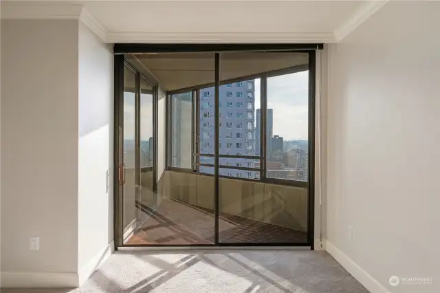 Primary bedroom leading to West Side balcony.