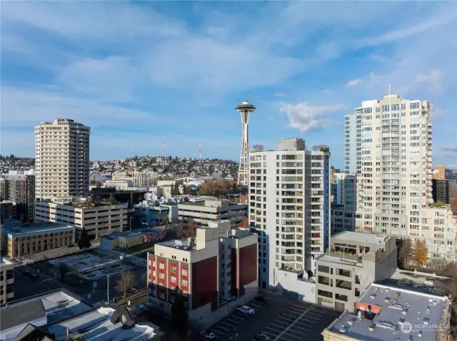 Drone front view of Harbour Heights condo with Space Needle and background.