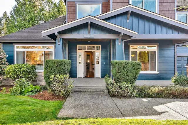 Welcome to your new home—a charming, covered front porch invites you to relax, unwind, and enjoy the perfect spot to greet neighbors or savor quiet moments in style