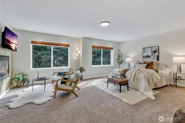 Double-door entry opens to the expansive, elegant primary suite, complete with a luxurious see-thru fireplace featuring a granite surround. Enjoy picturesque, private views of the serene dedicated wetlands from this peaceful retreat.