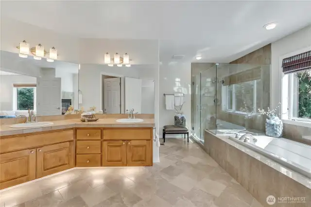 Step through the double-door entry into the lavish 5-piece bath, complete with dual sink porcelain-topped vanities and elegant toe-kick lighting for a touch of luxury. Pure relaxation awaits.