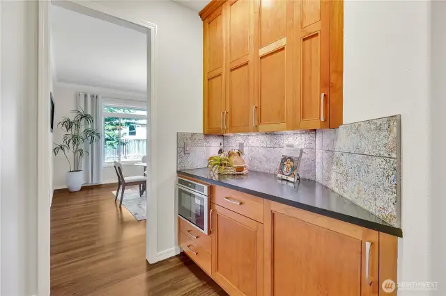 Convenient butler's pantry off the dining room, featuring a built-in microwave for added functionality and ease.