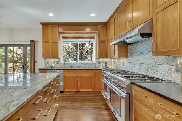 Stunning remodeled kitchen, completely updated from the studs out in 2018, featuring top-of-the-line finishes and appliances, including cherry cabinets and a Thermador professional stove and oven.