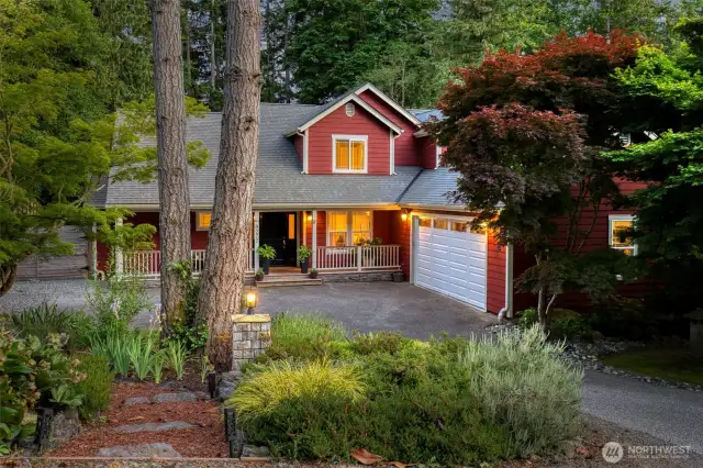 Charming Bainbridge Island home nestled among mature trees, offering privacy and a warm welcome from the moment you arrive.