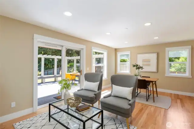 Spacious and bright, this secondary living area offers the perfect spot for reading, relaxing, or entertaining guests.