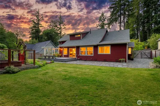 Enjoy serene sunset views from the expansive backyard, ideal for gatherings or quiet evenings under the stars.