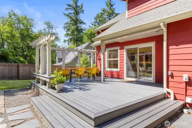 Step seamlessly from indoors to outdoors on this spacious back deck designed for relaxing and entertaining.