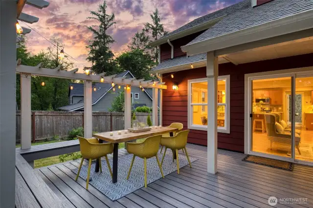 Step out onto a stunning deck built for entertaining, complete with built-in bench seating and seamless indoor-outdoor flow.