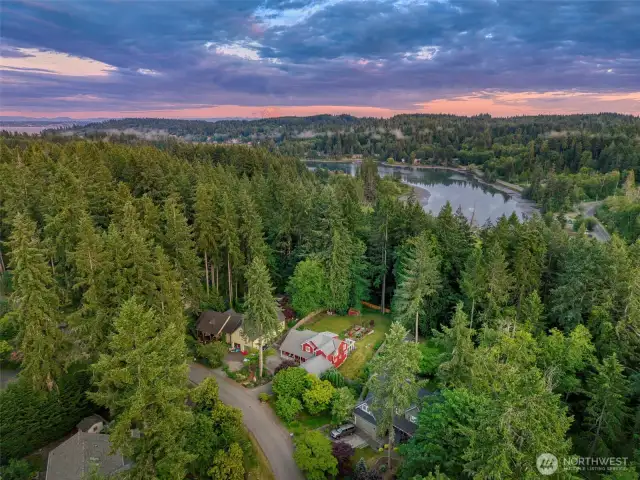 This stunning aerial view captures the lush natural surroundings and peaceful privacy of your own Bainbridge retreat.