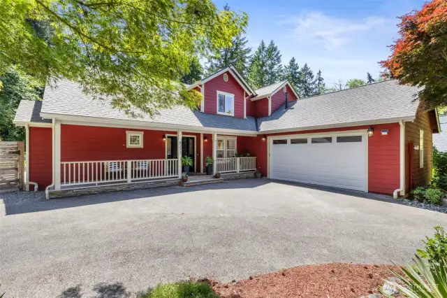 Ample parking and a spacious two-car garage offer convenience and functionality in a beautifully designed exterior.