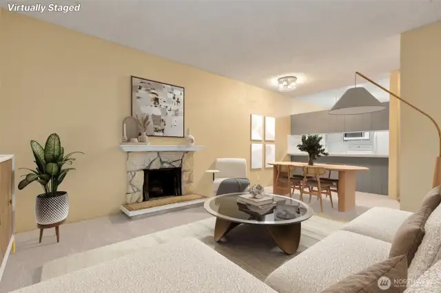 Living area with adjoining dining space. Passthrough from the kitchen to the dining area. (virtually staged)