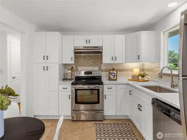 All new cabinets, countertops, kitchen sink, and hood vent. All appliances stay!