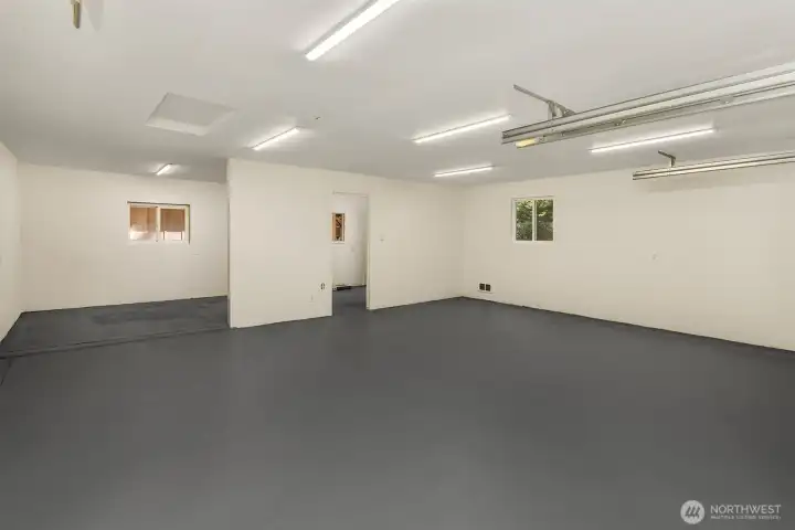 Spacious garage with additional rooms for a shop, includes brand new utility sink