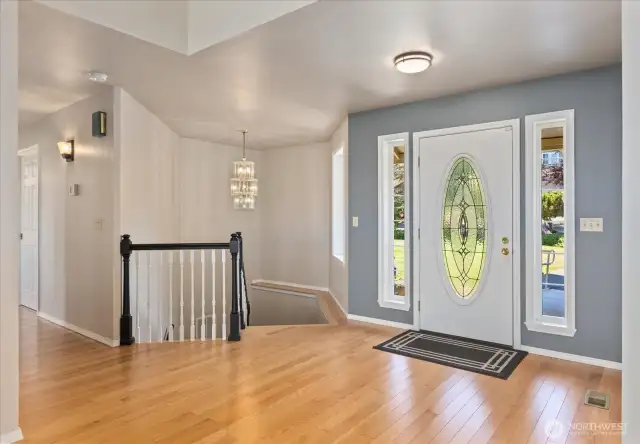 Black painted handrails lead to the daylight basement.
