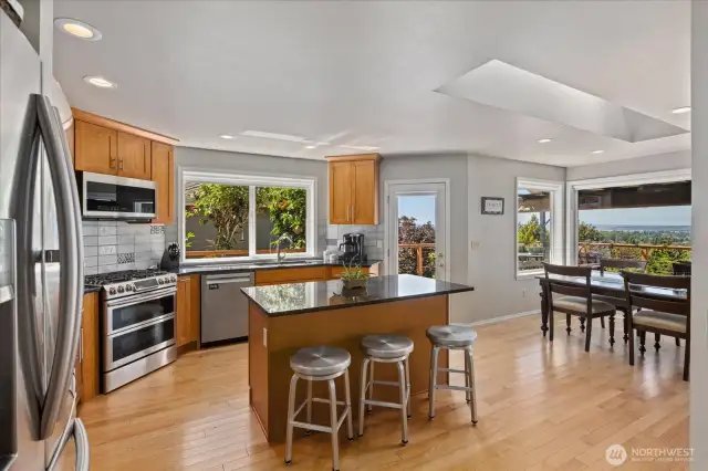 Granite counters and beautiful tile backsplash.
