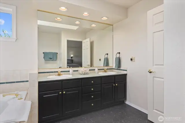 5 piece primary bath with new vinyl floor.
