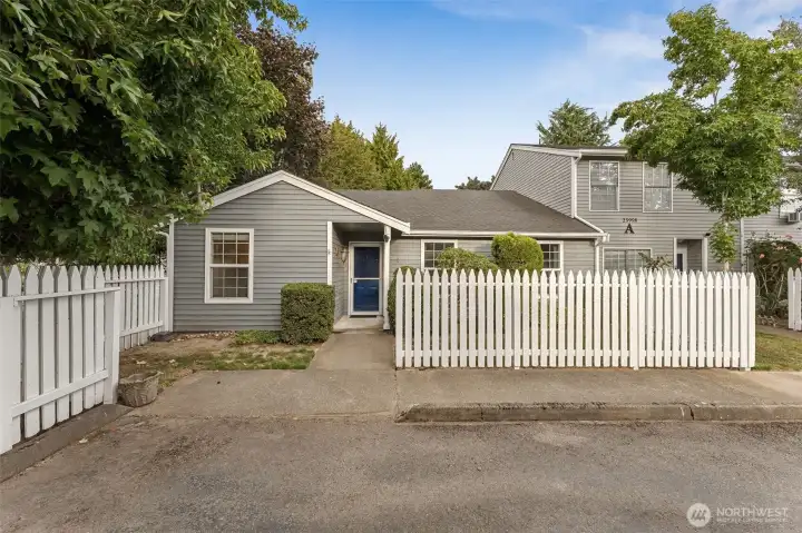 Updated single-level end-unit condo w/ exceptional privacy & peaceful garden views.