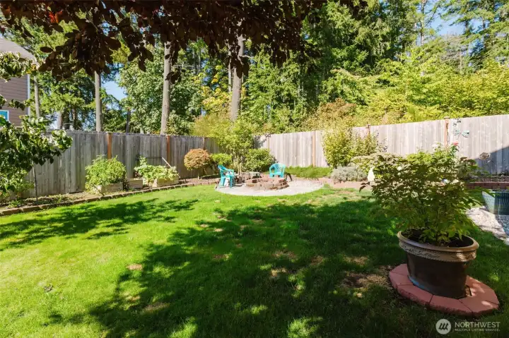 Spacious fully fenced in backyard with Garden space and fire pit for summer nights