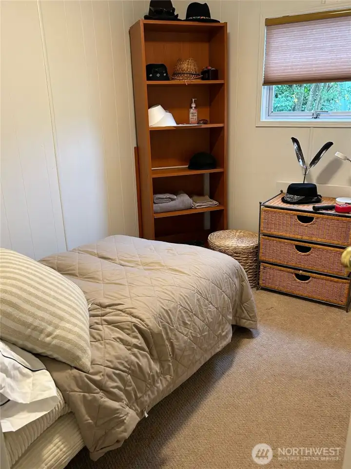 2nd bedroom set up as a guest room. Built in storage to the right of the door.