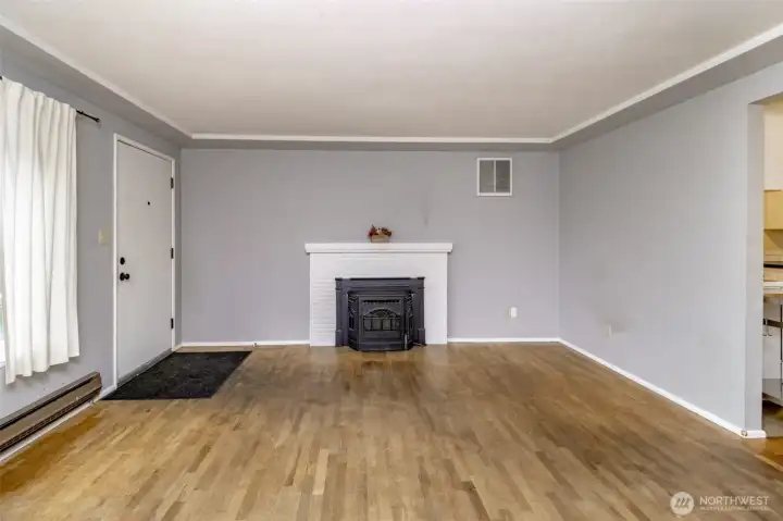beautiful fireplace with wood floors in living room