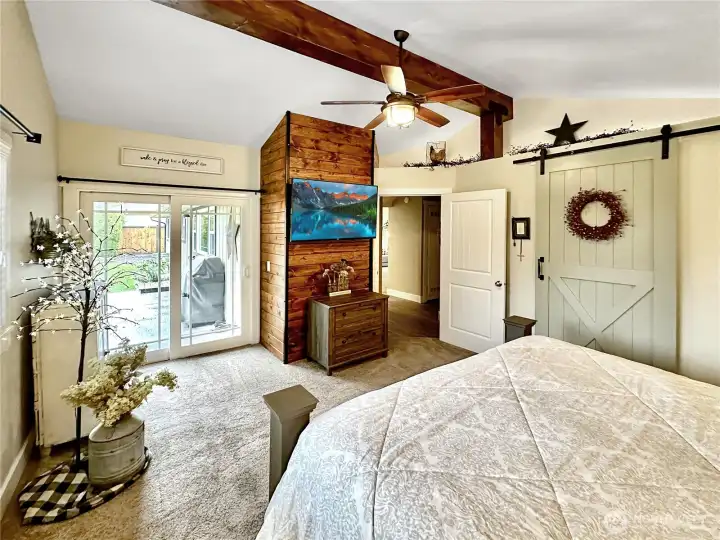 Access to patio and rear yard from primary  Ceiling fan too.