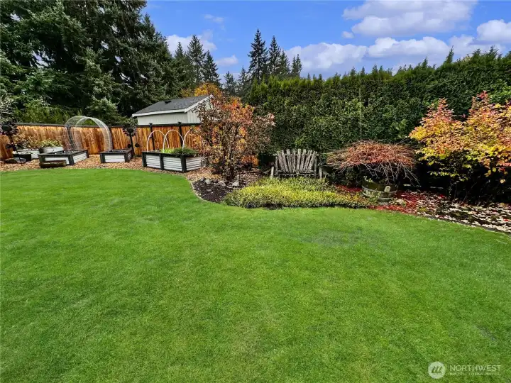 Gorgeous, raised beds, yard has been designed for low maintenance, sprinkler system and drip system in garden beds.  Beautiful garden views wherever you look.