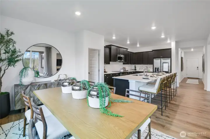 Dining to Kitchen- Huge island and a Pantry the size of a bedroom!