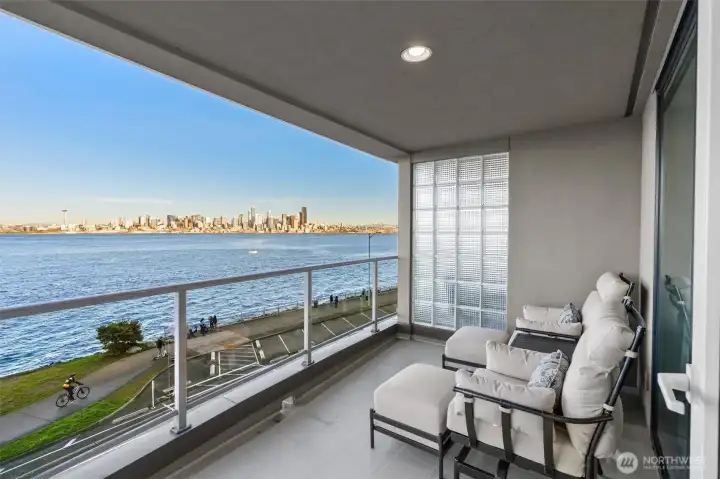 A generous, covered view deck—accessible from both the living room and the Primary Suite—sets the stage for effortless indoor-outdoor living. Just steps from the downtown water taxi, this prime location is perfect for enjoying Seahawks or Mariners games without the inconvenience of driving or parking.