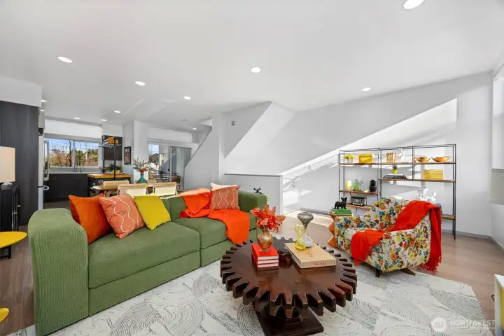 On the second level, the living area connects to the kitchen, making the space feel open and Iairy