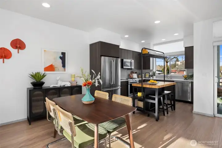 An open dining area flows directly into the kitchen, ideal for both casual dinners and entertaining.