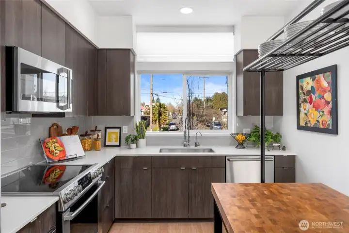 A well-designed kitchen with generous counter space, modern cabinetry, and great natural light.