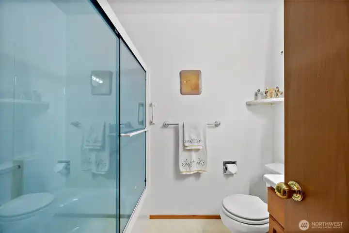 Hallway bathroom with bathtub