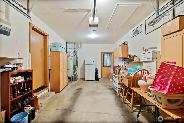 Deep one car garage  Fridge and storage units can stay