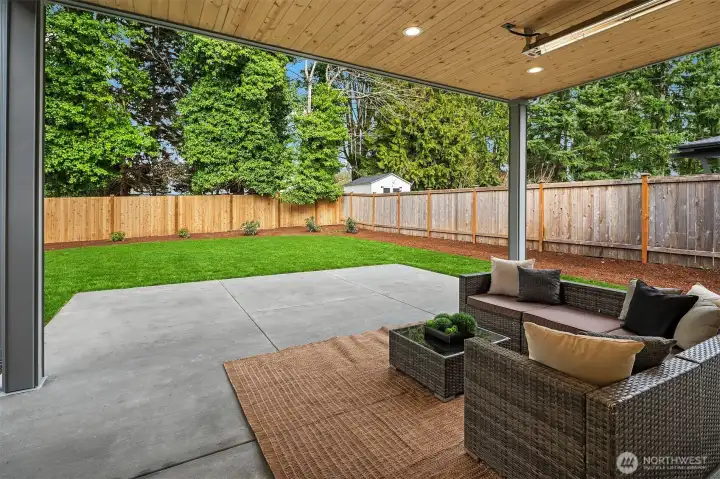 Outdoor covered living area with heaters