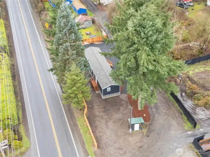 Well house is foreground is shared with neighboring lot occupied by a landscaping company.