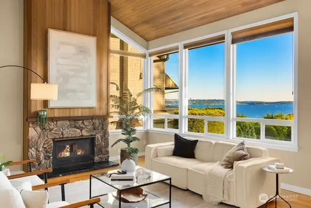 Warm and inviting living room space looking out to the lake view.