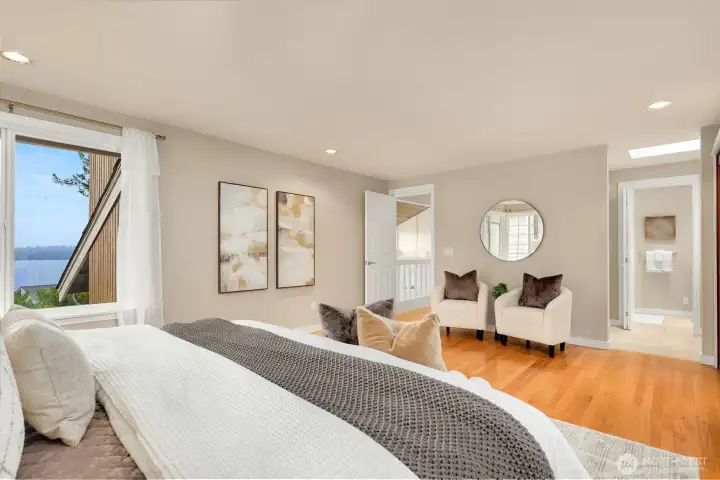 The primary bedroom suite takes in natural light and commanding views.