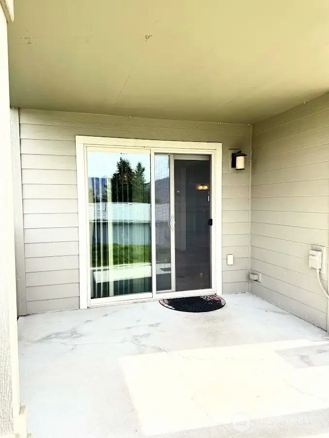 covered private back patio off of the dining room