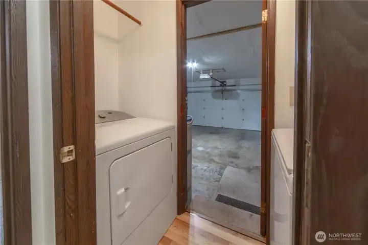 Hallway to the garage. Laundry room is located between the garage and hallway. Very practical