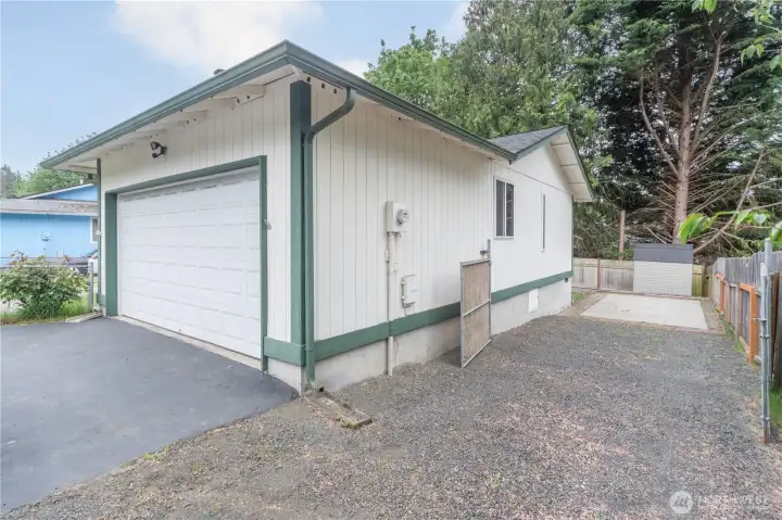 Right side of the garage has extra space for the parking and you see the RV pad behind the gates