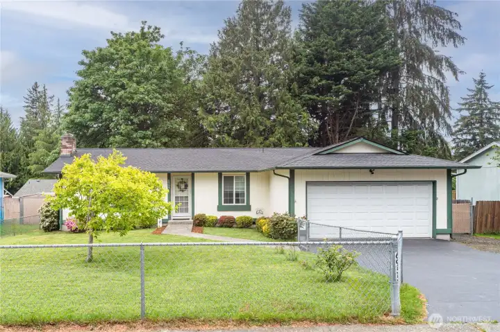 Plenty of room for kids or pets to running around in this fully fenced front and backyard