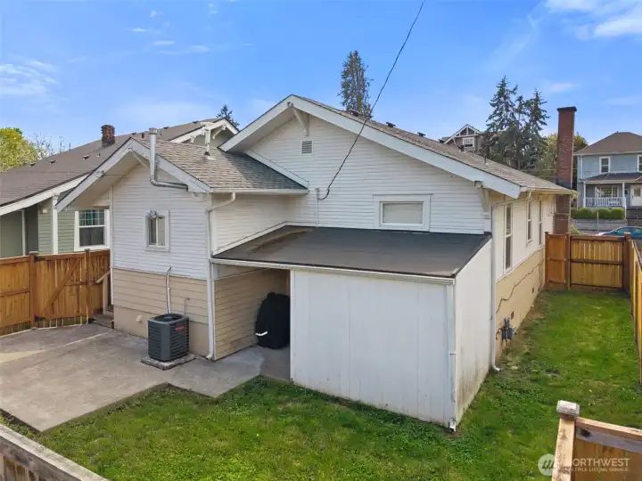 Patio with storage shed.