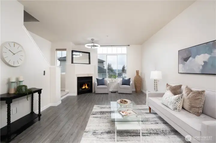 The living area is lined with oversized window that floods the space with natural light, creating a bright and welcoming atmosphere throughout the day.
