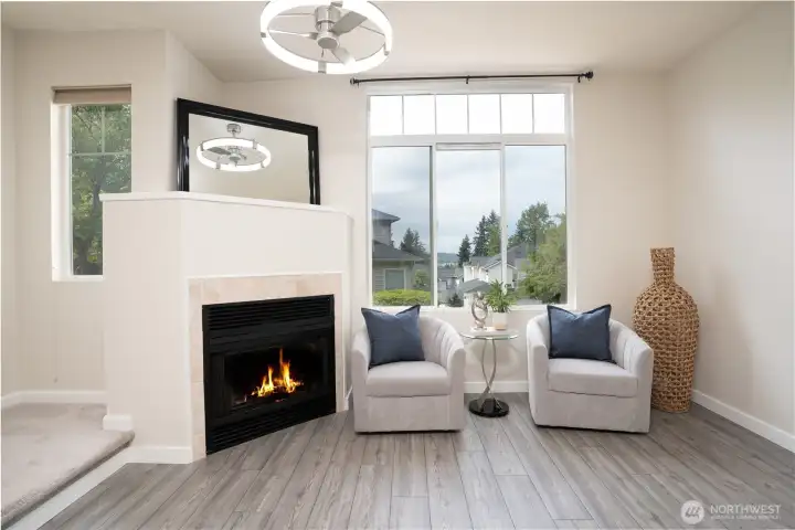 A cozy gas fireplace anchors the living room, adding warmth and ambiance at the touch of a button.