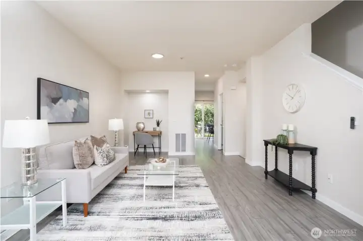 The living room includes a cozy nook perfect for a desk, along with a conveniently placed coat closet just off the kitchen.